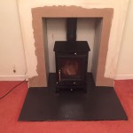 FInished stove installation ready to paint with 25mm slate hearth cut to size