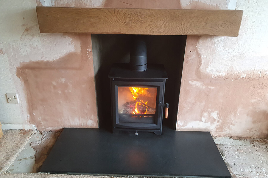 Completed fireplace renovation and woodburner installation